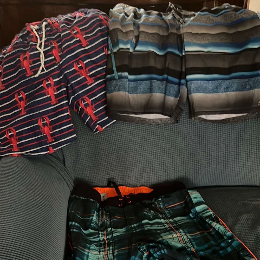 Three pair men’s swim trunks